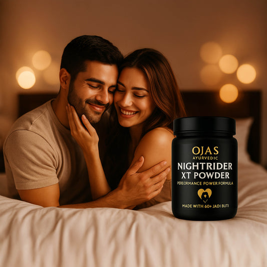 Couple embracing on a bed with a bottle of Ojas Ayurvedic Nightrider XT Powder in the foreground.